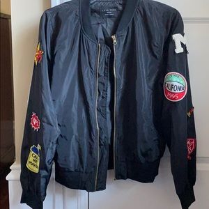 Black bomber jacket with appliqués